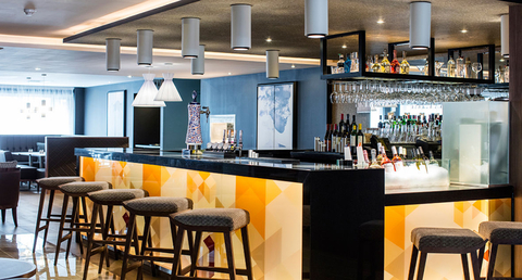 AC Hotel by Marriott Birmingham, England bar with stools