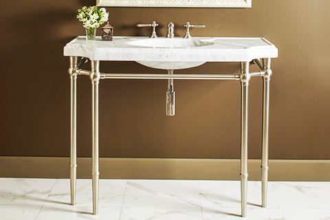 Bayonne console sink The Bayonne console sink was sculpted and beveled from a single block of Italian Carrara Marble and rests on finely crafted tapered legs that recall a classic design.