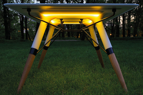 Table T designedby announced the Table T, a table with built-in LED strip under the its surface to warm the room and atmosphere around it.