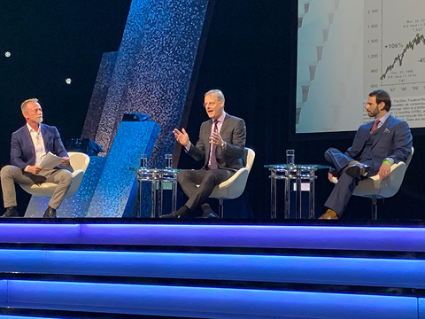 ALIS CBRE Journalist and moderator Simon Hobbs (left) listens as Richard Barkham of CBRE (center) makes a point during opening day session while JLL economist Ryan Severino looks on.