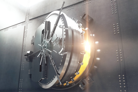 Bank vault opening and showing light Open bank vault door and gold light