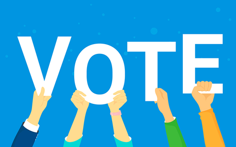 Vote hands holding letters that spell out "vote"