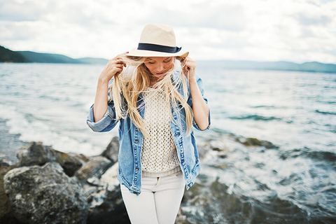 woman by the beach // Photo by shironosov/iStock/Getty Images Plus/Getty Images woman by the beach