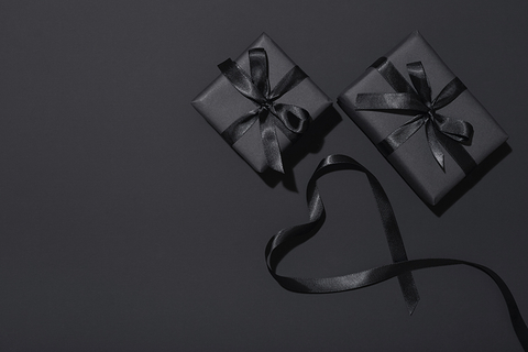 two gifts wrapped in black // Photo by melecis/iStock/Getty Images Plus/Getty Images two gifts wrapped in black