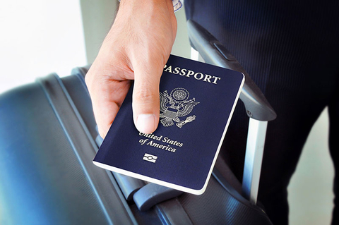 Hand Holding U.S. Passport Hand Holding U.S. Passport