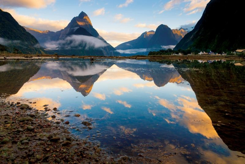 Seabourn's 2018-2019 Australia Season Mountains and clouds are reflected in water