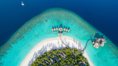 Anantara Kihavah An aerial view of the resort, showing the buildings, beach and water