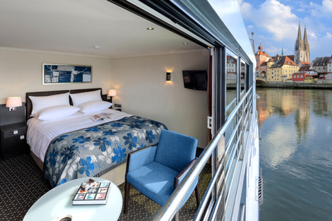 Avalon Waterways Panorama Suite An open Avalon Waterways panorama suite with a town visible in the background