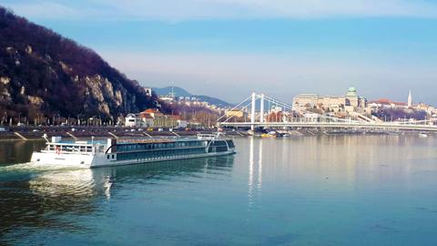 AmaMagna Image of the upcoming ship cruising the river near a bridge