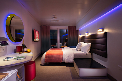Virgin Voyages Scarlet Lady Room A cabin aboard the Scarlet Lady at night