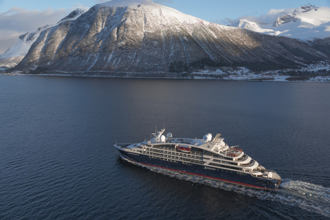 Le Bougainville Image of the new ship cruising near a mountain