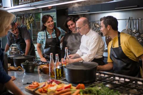 Discovery Cooking Demonstration Image of individuals in a kitchen learning how to cook