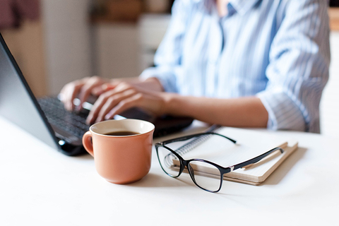 woman on laptop with coffee woman on laptop with coffee