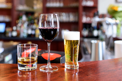 A spirit, a glass of wine and a beer on a bar Spirit, wine and beer on a bar