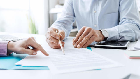 Negotiating a lease Business people negotiating a contract