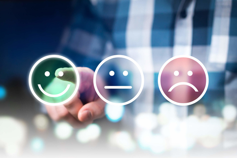 Smiley face, neutral face and frowning face Person choosing smiley face, neutral face or frowning face