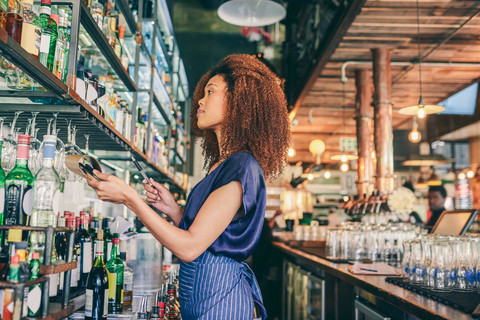 Bar owner doing liquor inventory Restaurant owner conducting liquor inventory