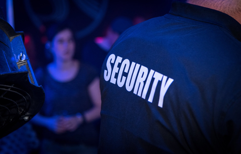 Back of security in a bar Back of security in nightclub