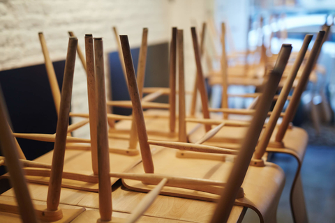 Chairs on top of tables in a restaurant Restaurant or bar ready for cleaning or closing