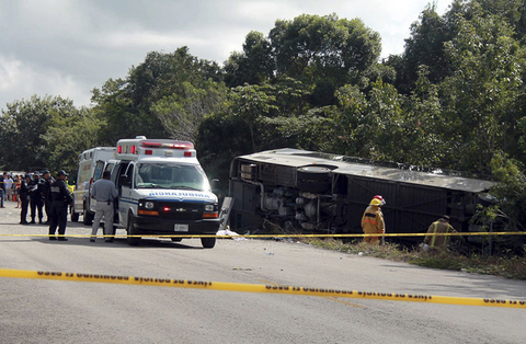 Mexico Bus Accident Newscred Editorial Travel Group Only An ambulance sits parked next to an overturned bus in Mahahual, Quintana Roo state, Mexico.