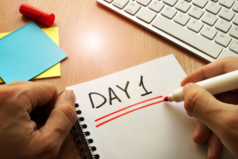 First Day on the Job Getty Hand writing day 1 on desk