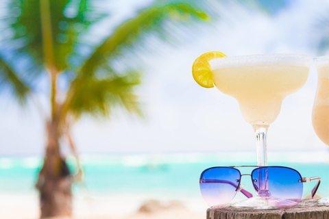Cocktails and sunglasses on a beach Margarita and sunglasses on a beach