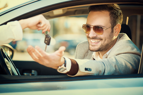 Car Rental Getty Man taking car key