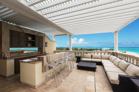 Bianca Sands' The Villa A view of the terrace and bar with the water in the background