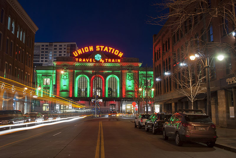 Denver Union Station Holidays Getty View of Union Station in downtown Denver, Colorado, taken at night from the middle of a street. The train station is lit up for the Christmas Holiday season