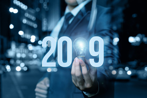 Man holding light bulb inside 2019 Light bulb 2019 prediction and forecast