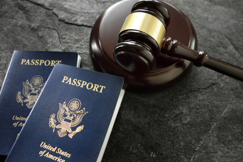 Gavel and passport A federal judge in Hawaii blocked President Trump's second travel ban hours before it was set to go into effect, and is quickly joined by another in Maryland.