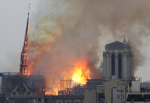 Notre Dame Fire AP Newscred Editorial Travel Group Only Flames rise from Notre Dame cathedral as it burns in Paris.