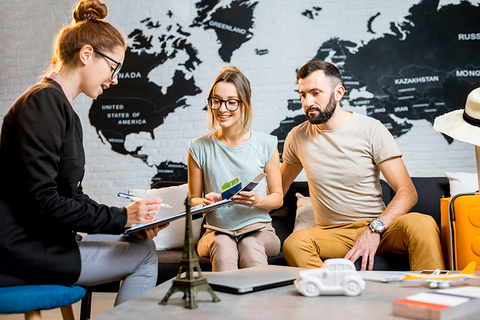 young travel advisor with couple young travel advisor with couple