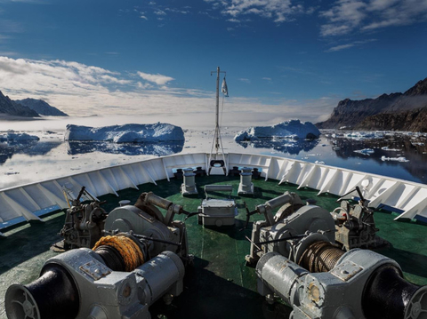 Adventure Canada Image of a ship traversing the arctic