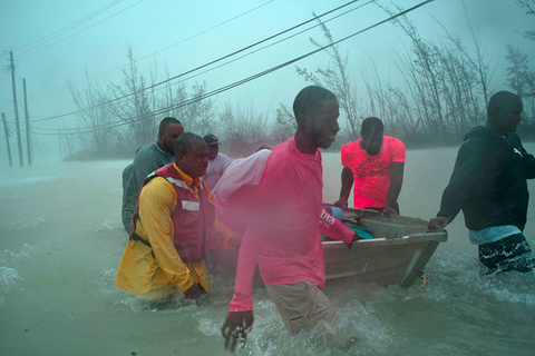 Hurricane Dorian Relief Newscred Editorial Travel Group Only Volunteers rescue several families from the rising waters of Hurricane Dorian, near the Causarina bridge in Freeport, Grand Bahama.