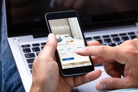 Man Booking Hotel Using Smartphone Man Booking Hotel Using Smartphone