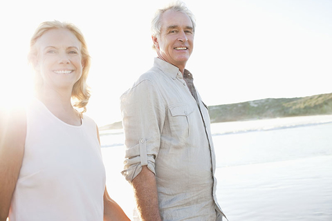 Baby Boomer Revised Credit OJO Images Getty Images Older couple walking on a beach
