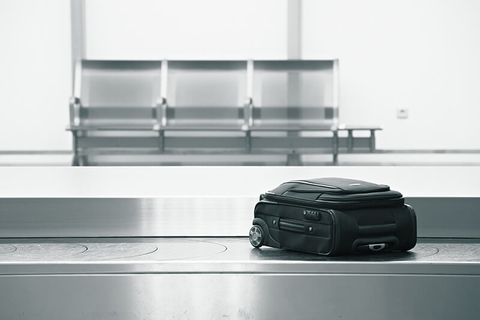 luggage on baggage claim // Photo by Chalabala/iStock/Getty Images Plus/Getty Images luggage on baggage claim