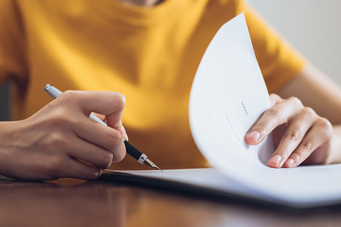 woman signing document woman signing document