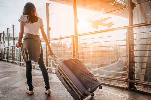 woman with luggage at airport woman with luggage at airport
