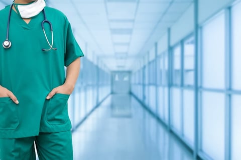 Practice Management doctor physician nurse scrubs hospital (Getty/NanoStockk) A physician in scrubs in a hospital hallway