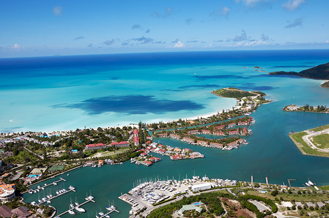 Jolly Harbor Antigua Getty Aerial view of Jolly Harbour with sea meeting sky on horizon