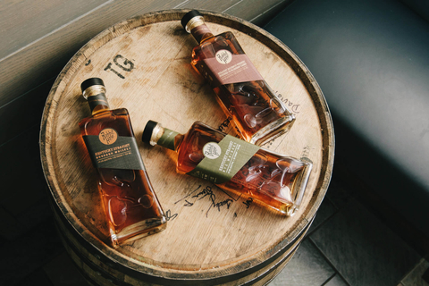 Rabbit Hole Distilling Co. whiskey bottles on a barrel - Falling Down the Rabbit Hole to Modernize Bourbon