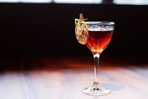Cocktail with dehydrated orange garnish at El Five in Denver, Colorado - How to Curate Your Instagram Presence