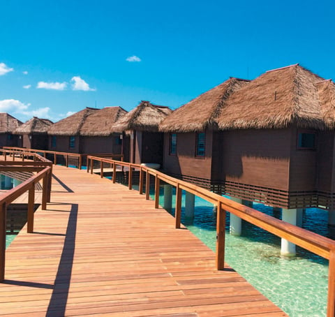 The over-the-water villas at Sandals Royal Caribbean, Montego Bay are connected to the resort’s private island by bridge.