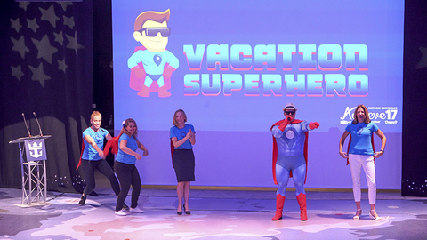 Vacation Superhero Dream Vacations General Manager of Network Engagement and Performance Drew Daly as the Vacation Superhero with members of the marketing team.