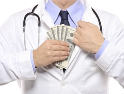 Doctor putting money into his white lab coat