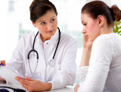 Unhappy female patient (CREDIT: Getty/AlexRaths) Unhappy female patient and doctor