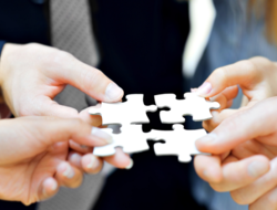 Puzzle pieces merger acquisition (iStockPhoto) iStockPhoto.com