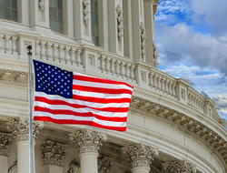 U.S. Capitol with flag (Credit: Getty/Andrea Izzotti) U.S. Capitol with flag